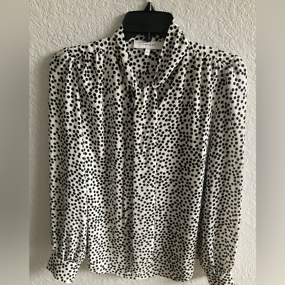 Tie neck blouse.